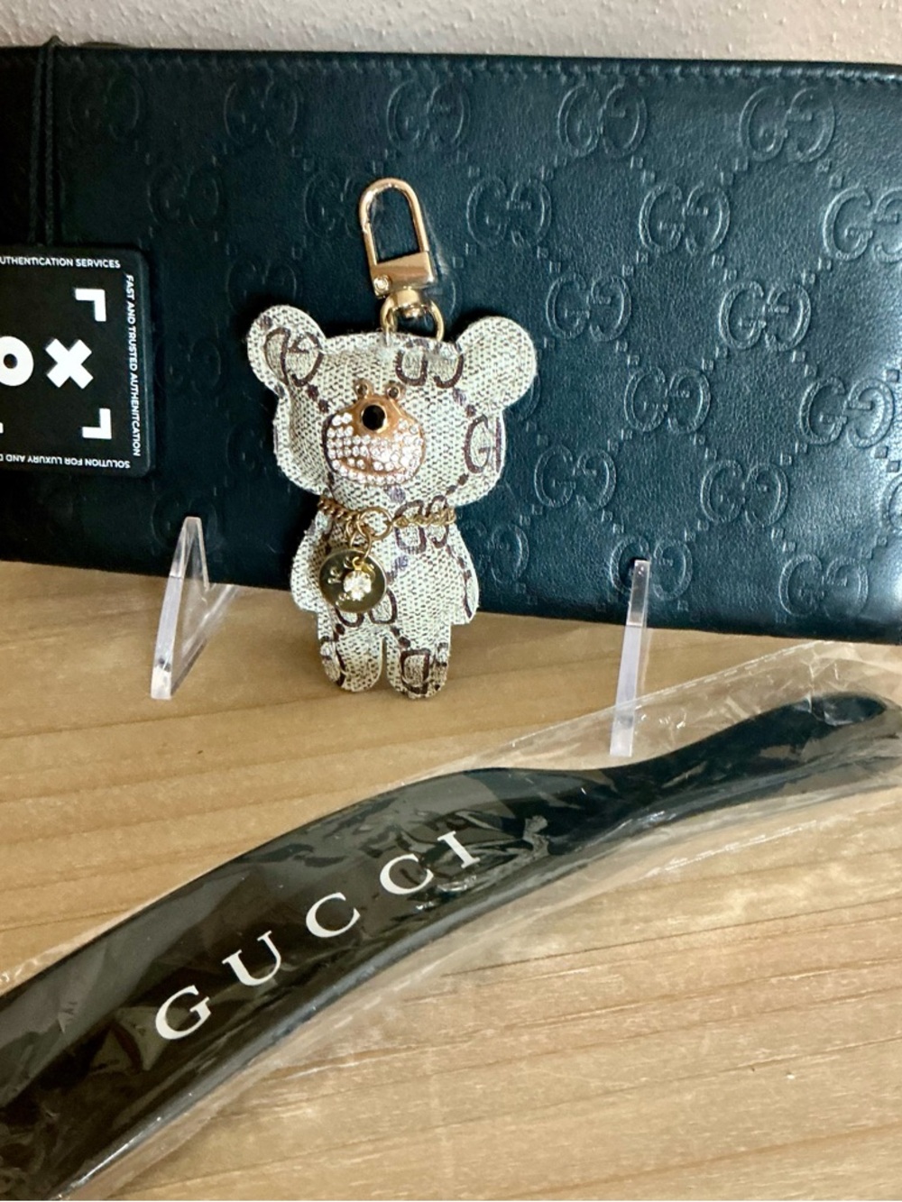 Gucci Black Embossed Leather Wallet with Upcycled Monogram Bear Charm.